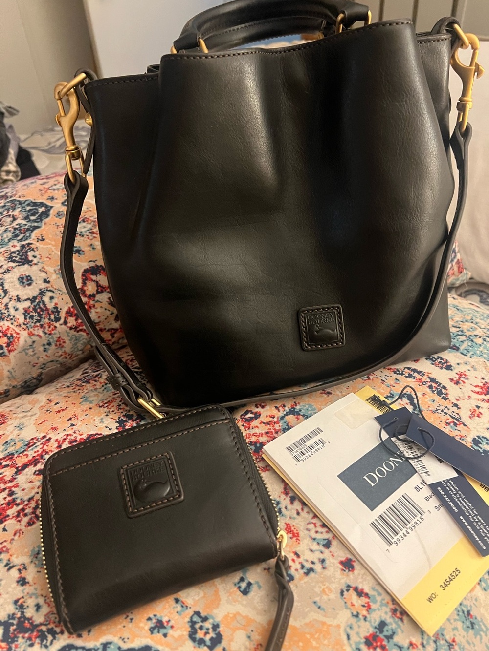 Dooney & Bourke Black Satchel with Gold Accents and matching wallet.